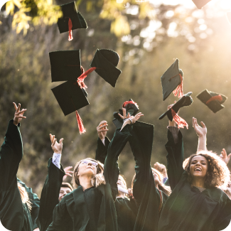 A group of people throwing their caps at graduation.