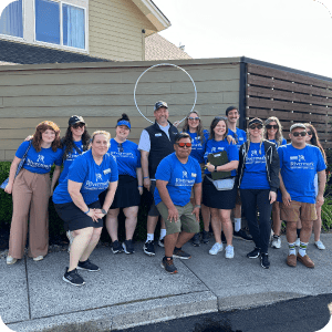 A group of Rivermark employees together at a volunteer event.