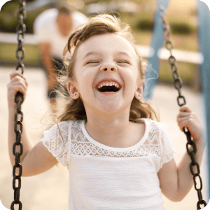 Young girl on a swing.