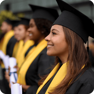 College graduates sitting in a line.