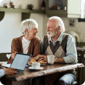 Mature couple looking at each other and smiling.