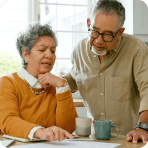 Mature couple looking at a document.