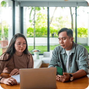 Couple looking at a computer together.