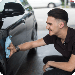 Man washing the exterior of his vehicle.