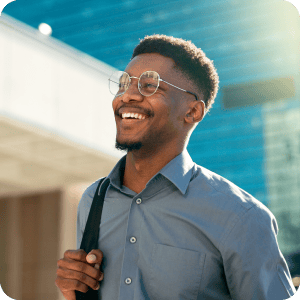 Happy man walking outside.