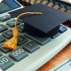 Graduation cap on a calculator.