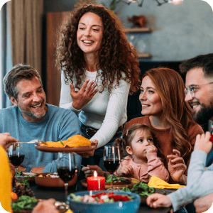 Family eating Thanksgiving dinner.