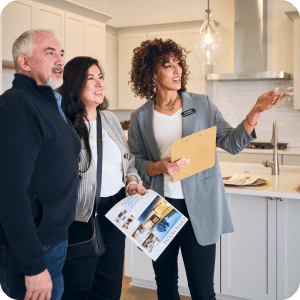 Older couple looking at new hoe they want to buy.