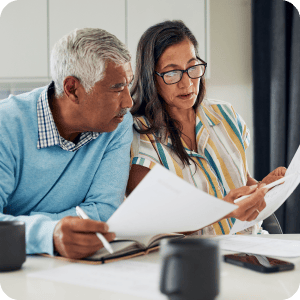 Mature couple reviewing their estate planning documents.