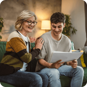 Mother and son looking at papers together.